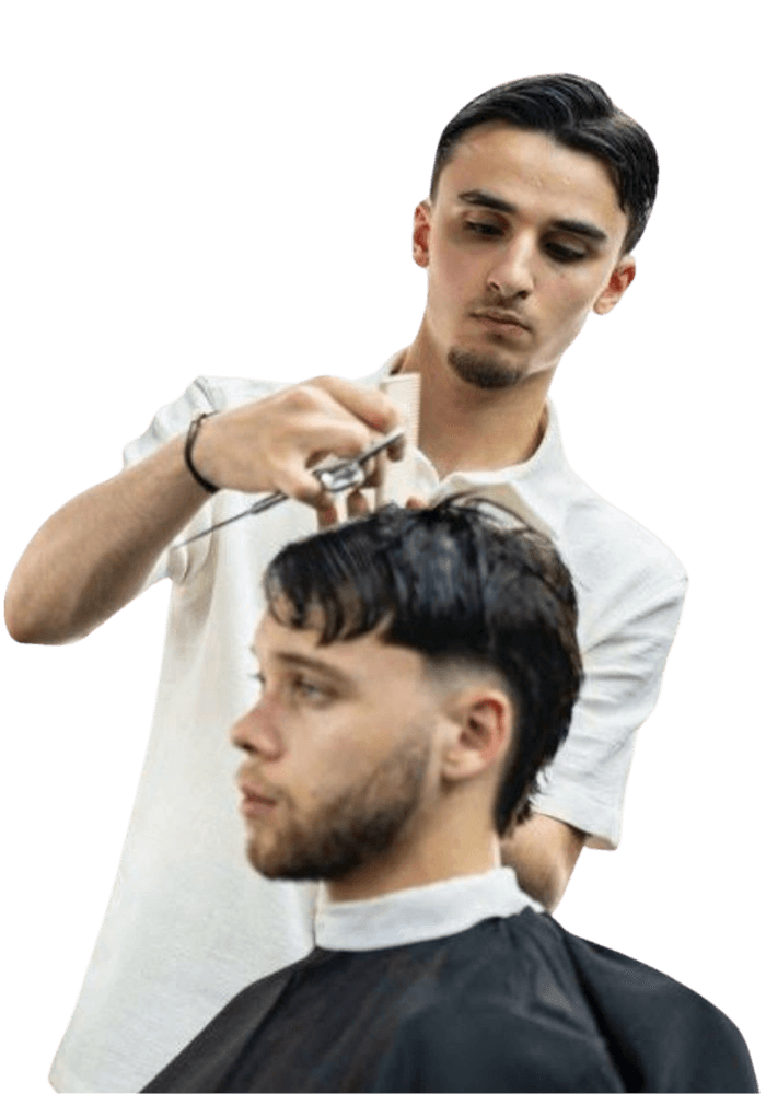 Burhan, barbier bij kapper Tilburg Barber's Inc., knipt een klant